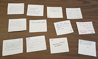 Twelve cards with handwriting on them